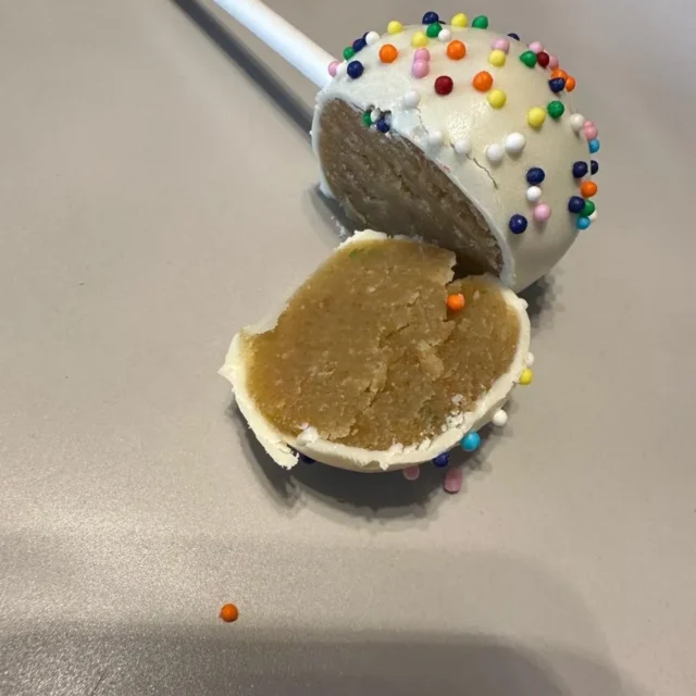 Sprinkle cake pop cut open to show the vanilla cake centre - Popcakes Ottawa