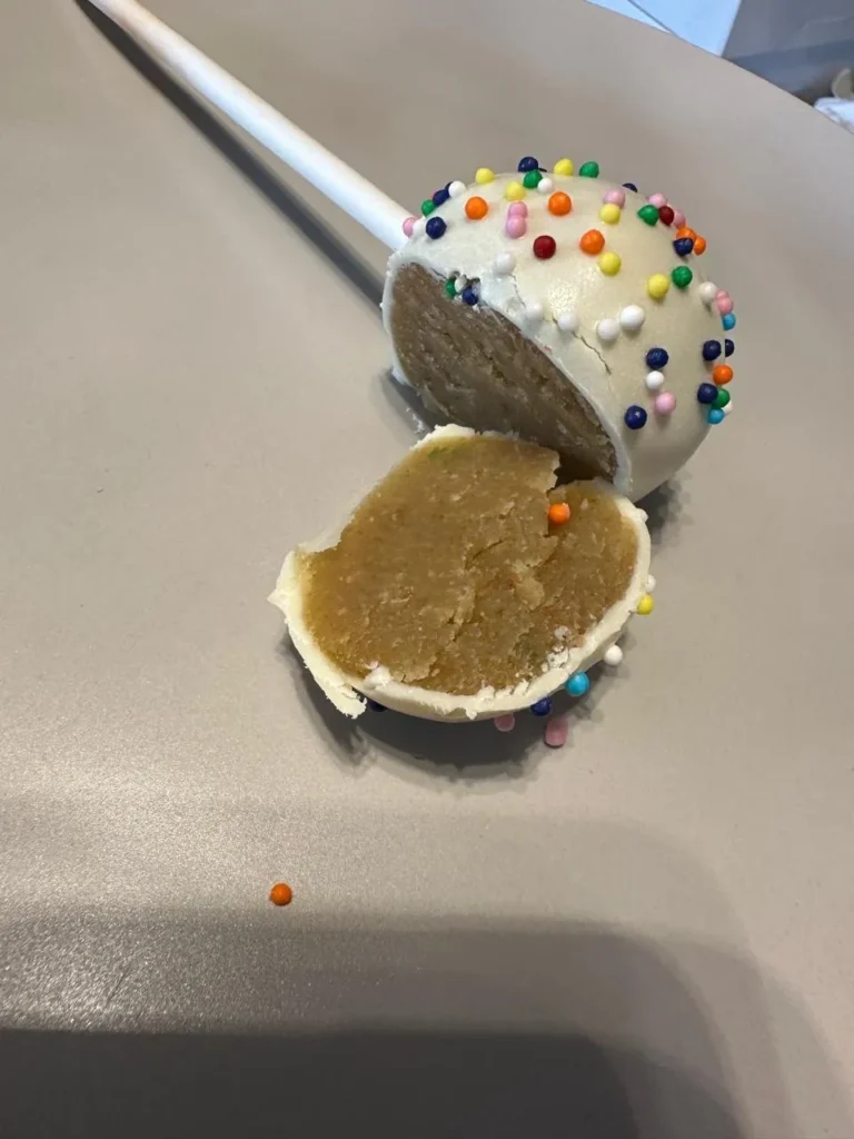 Sprinkle cake pop cut open to show the vanilla cake centre - Popcakes Ottawa