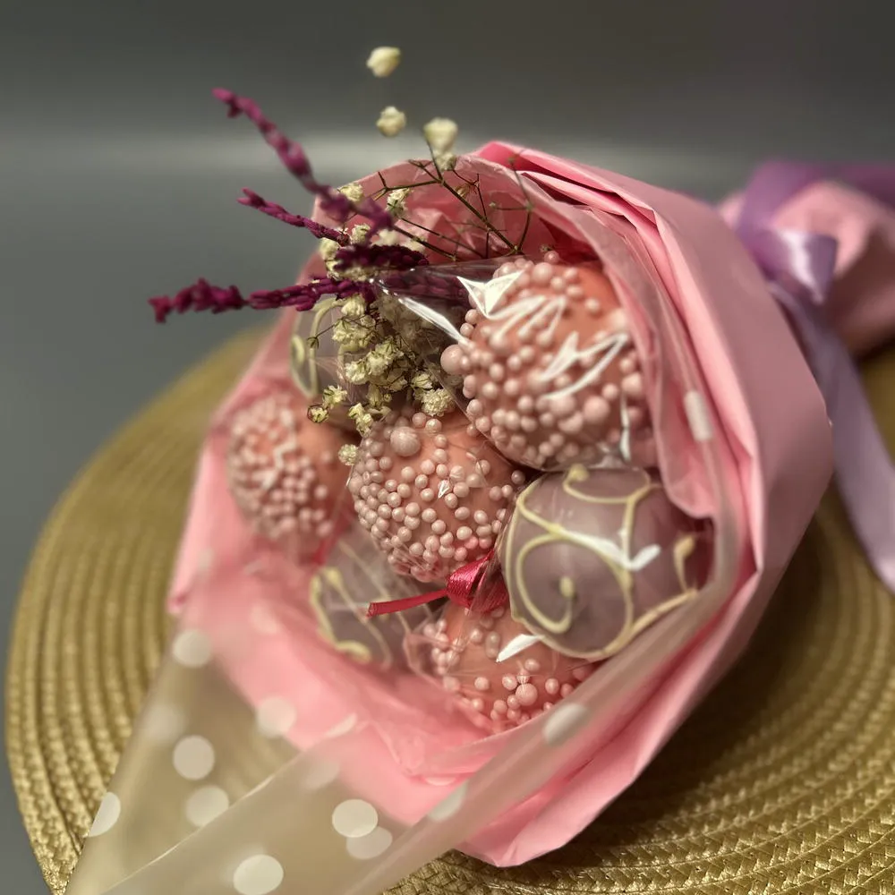 Close-up of sprinkle cake pops inside pink bouquet wrapping - Popcakes Ottawa