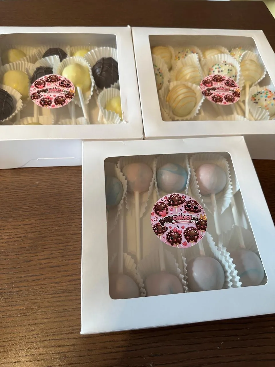 Three gift boxes of assorted cake pops with Popcakes stickers - Popcakes Ottawa