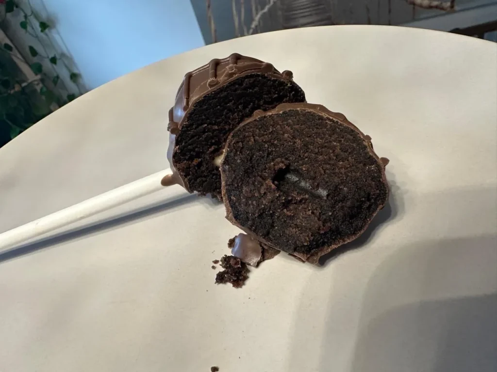 Chocolate cake pop cut in half on a plate - Popcakes Ottawa