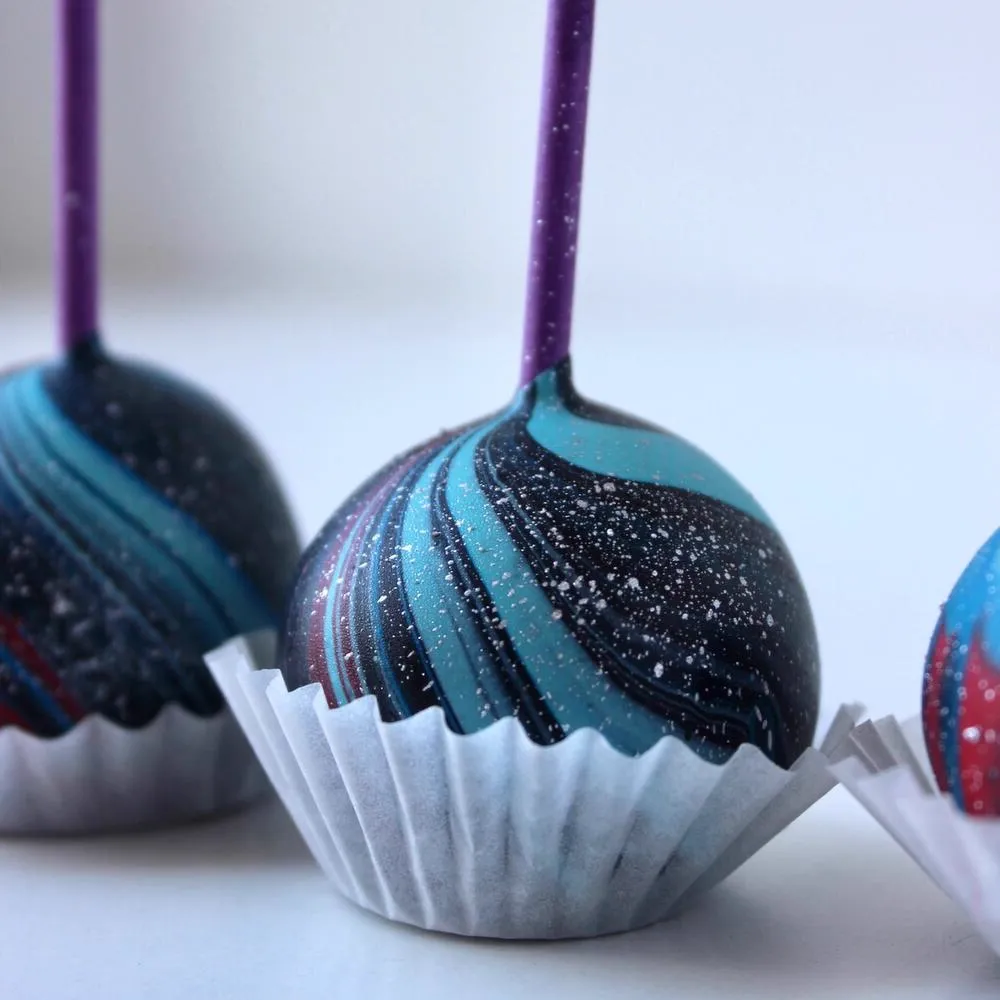 Shimmering blue swirl detail on dark cake pops - Popcakes Ottawa