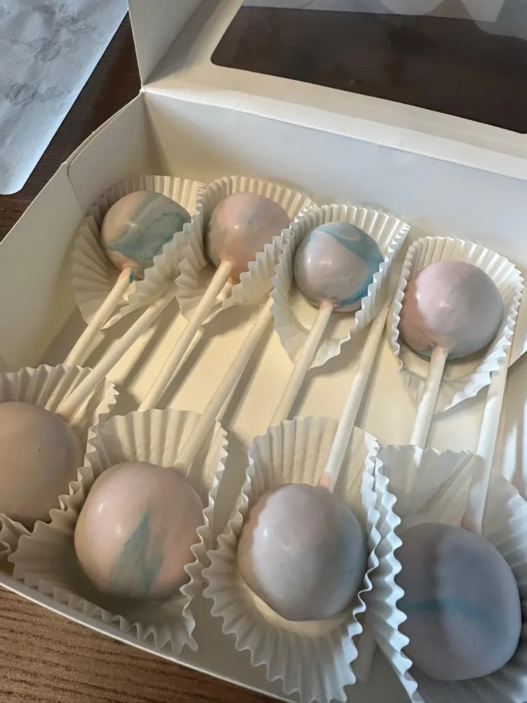 Pink and blue marbled cake pops in an open gift box - Popcakes Ottawa