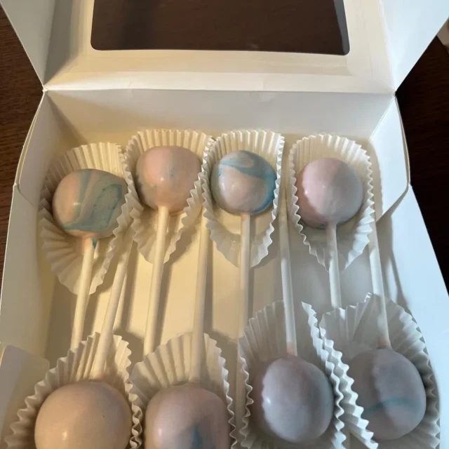 Pastel pink and blue marbled cake pops in an open box - Popcakes Ottawa