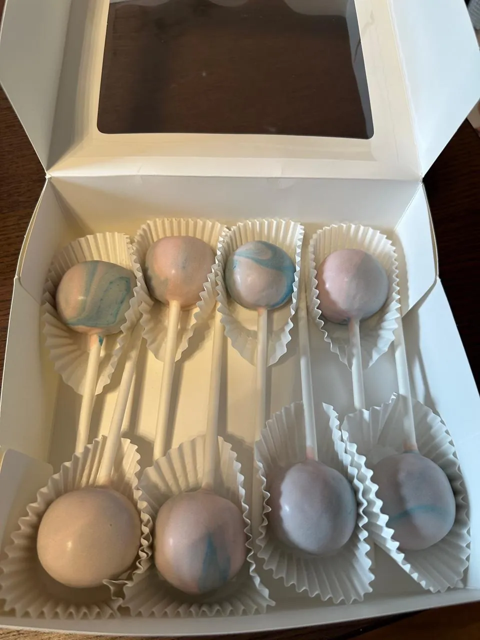 Pastel pink and blue marbled cake pops in an open box - Popcakes Ottawa