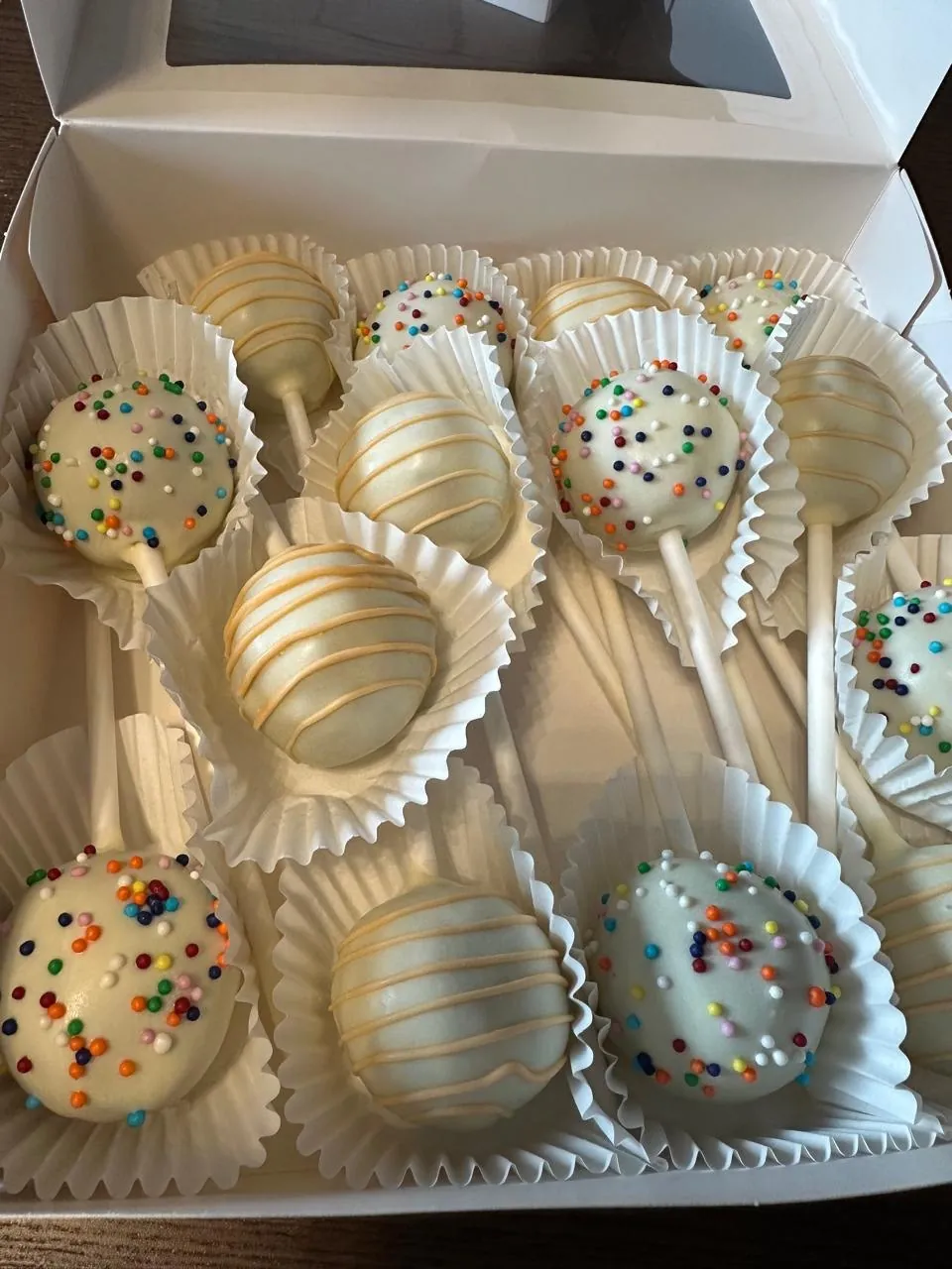 White cake pops with sprinkles and drizzle in a gift box - Popcakes Ottawa