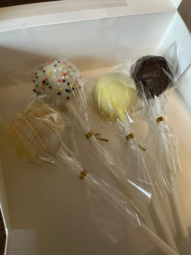 Assorted wrapped cake pops in a white box - Popcakes Ottawa