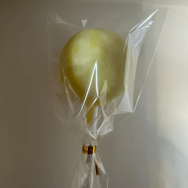 Wrapped yellow candy-dipped cake pop - Popcakes Ottawa